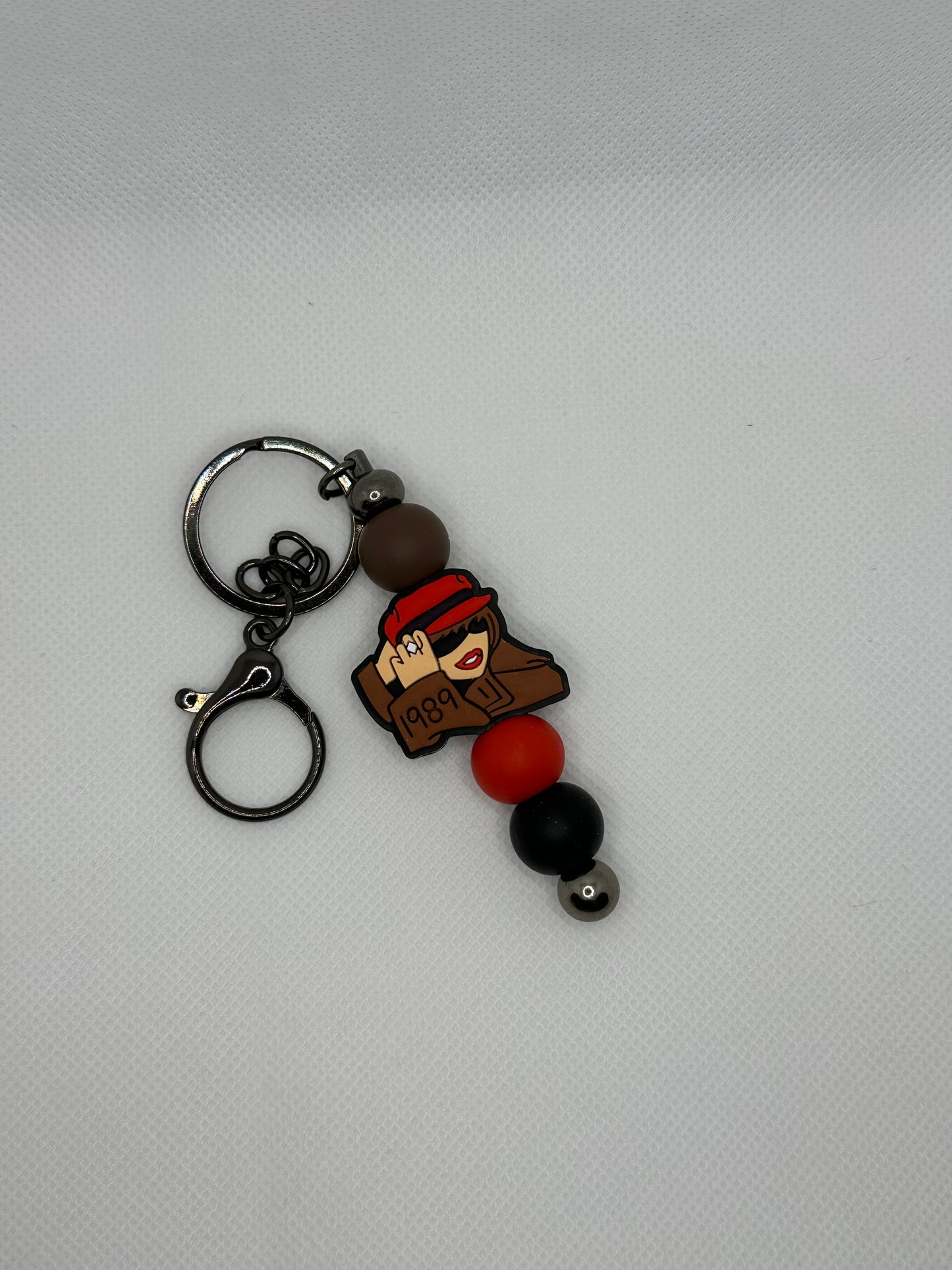 Taylor 1989 Silicone Beaded Gunmetal Metal Keychain