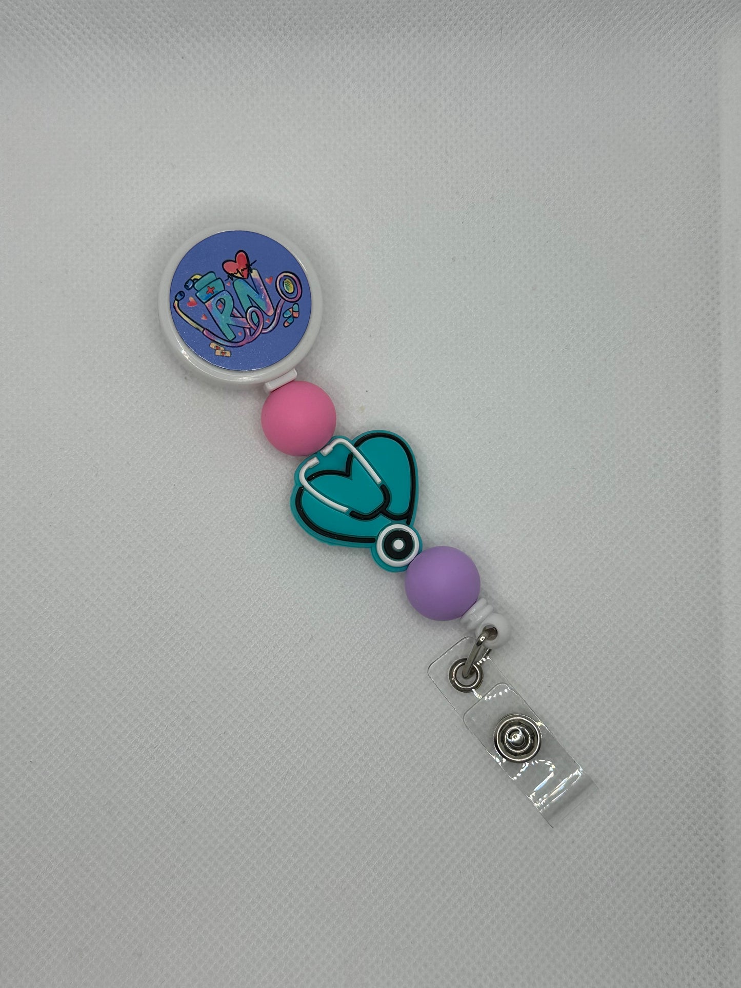 Registered Nurse Teal Stethoscope White Badge Reel