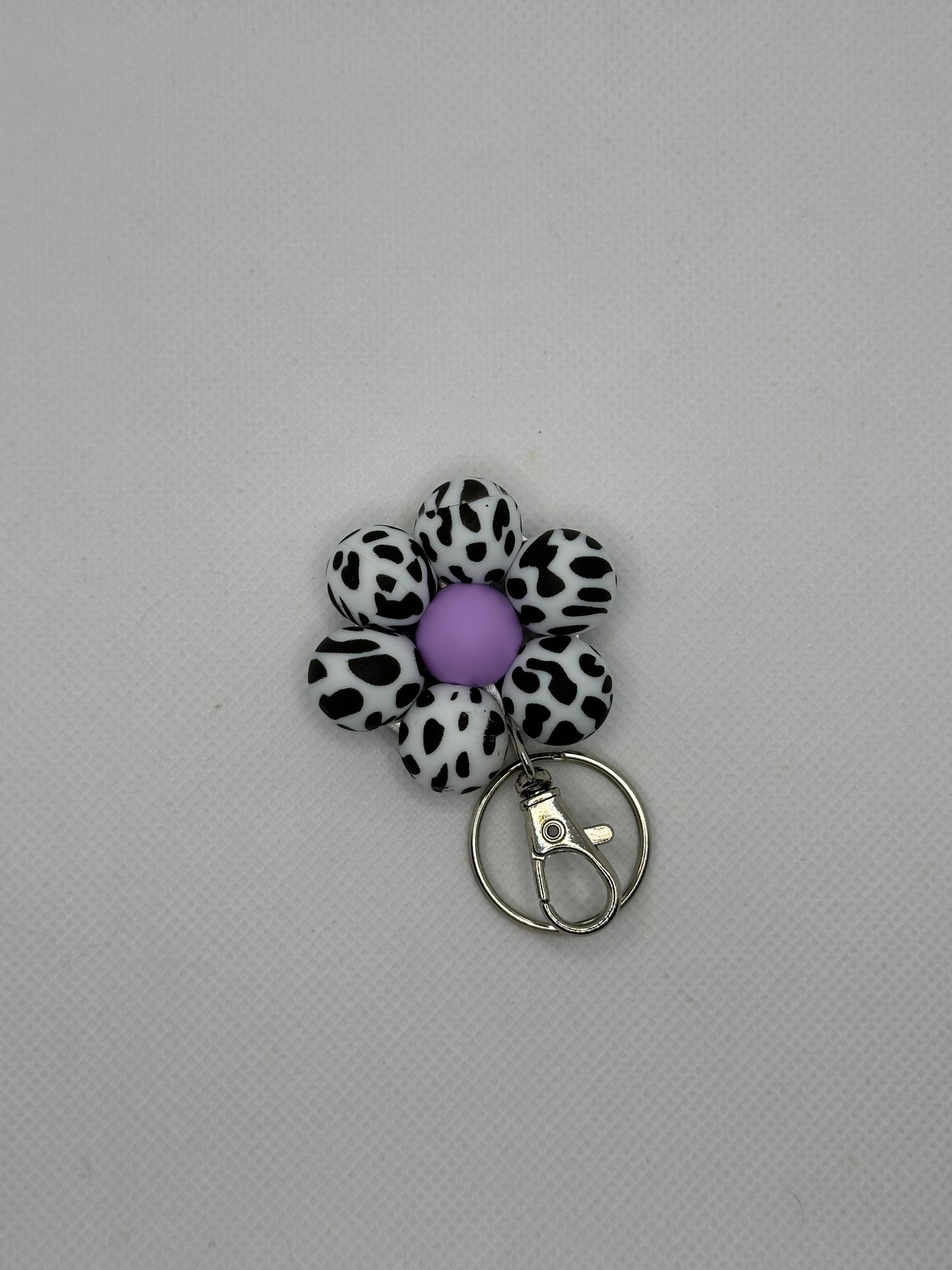 Black Cow And Lilac Flower Keychain